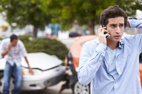 A man calling an attorney after a car accident.