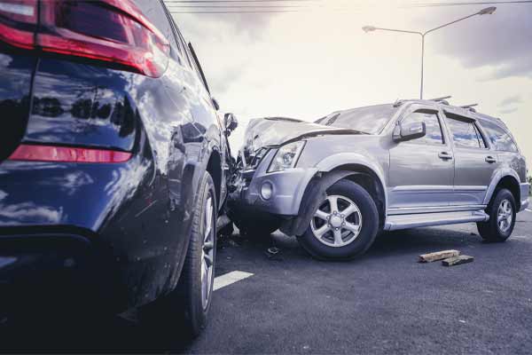 An image of two cars in a head-on accident