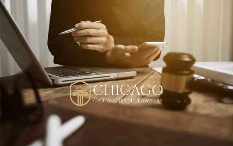 person sitting at computer chicago car accident lawyer